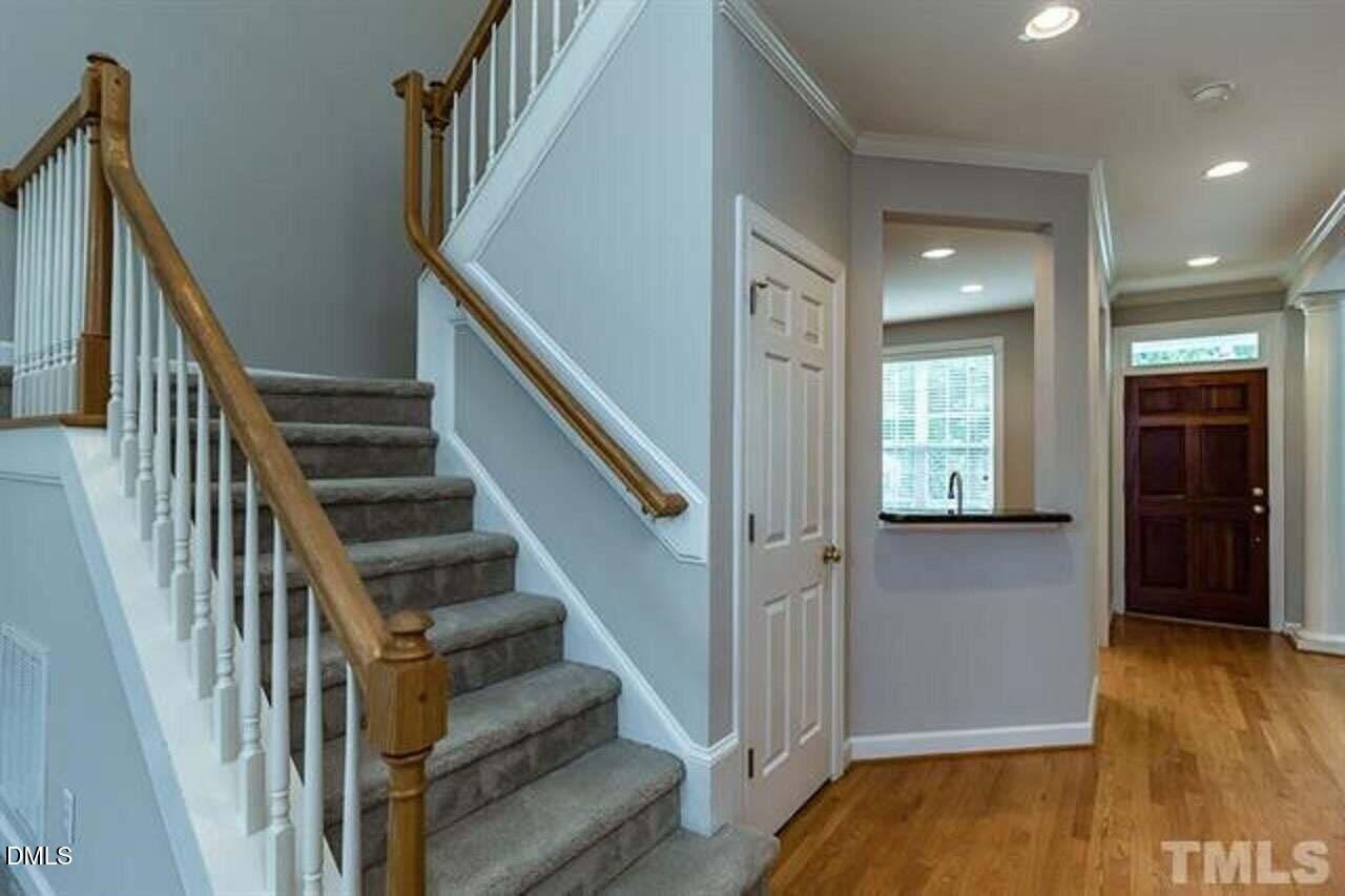 1216 Colonial Club Road Wake Forest, NC 27587 - Photo 4 of 26 a view of entryway and hall with wooden floor