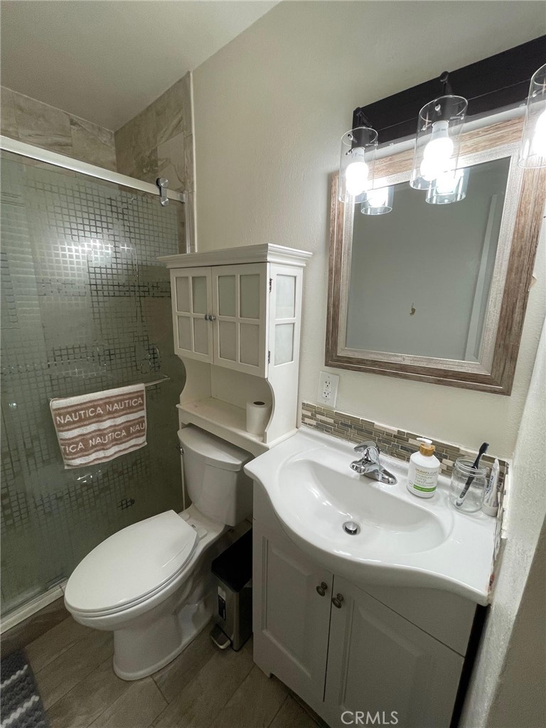 840 East Meadbrook Street Carson, CA 90746 - Photo 18 of 32 a bathroom with a sink mirror vanity and toilet