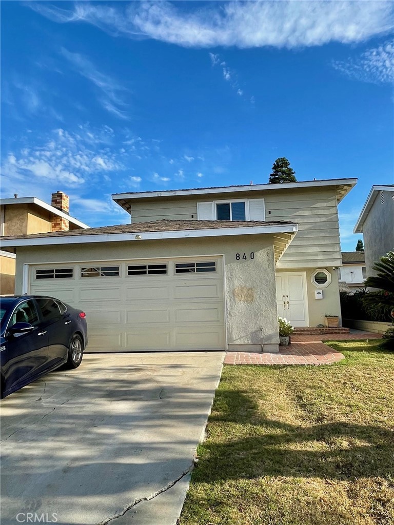 840 East Meadbrook Street Carson, CA 90746 - Photo 2 of 32 a view of a car parked front of a house