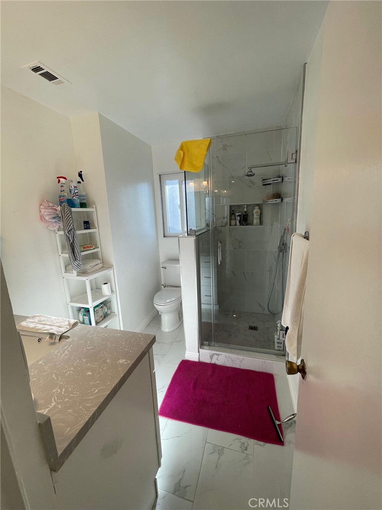 840 East Meadbrook Street Carson, CA 90746 - Photo 25 of 32 a bedroom with a bed and a dresser