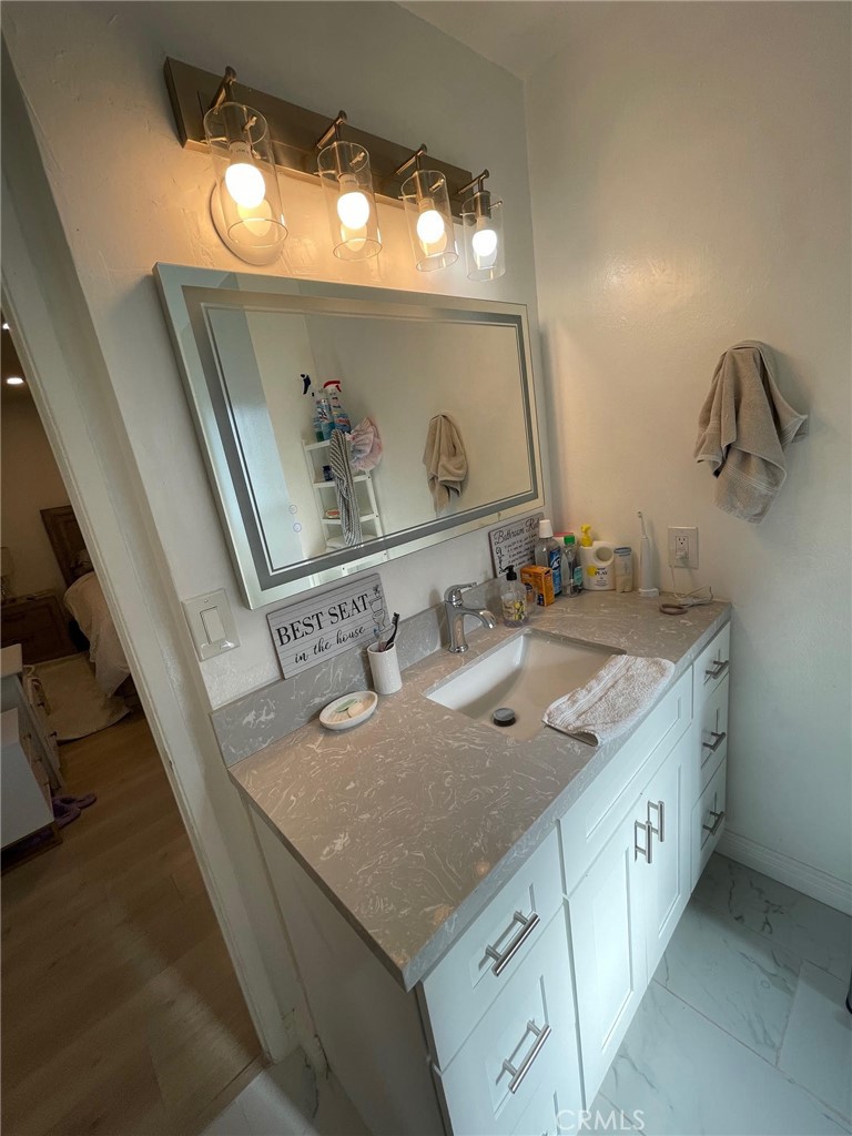840 East Meadbrook Street Carson, CA 90746 - Photo 26 of 32 a bathroom with a sink and a mirror