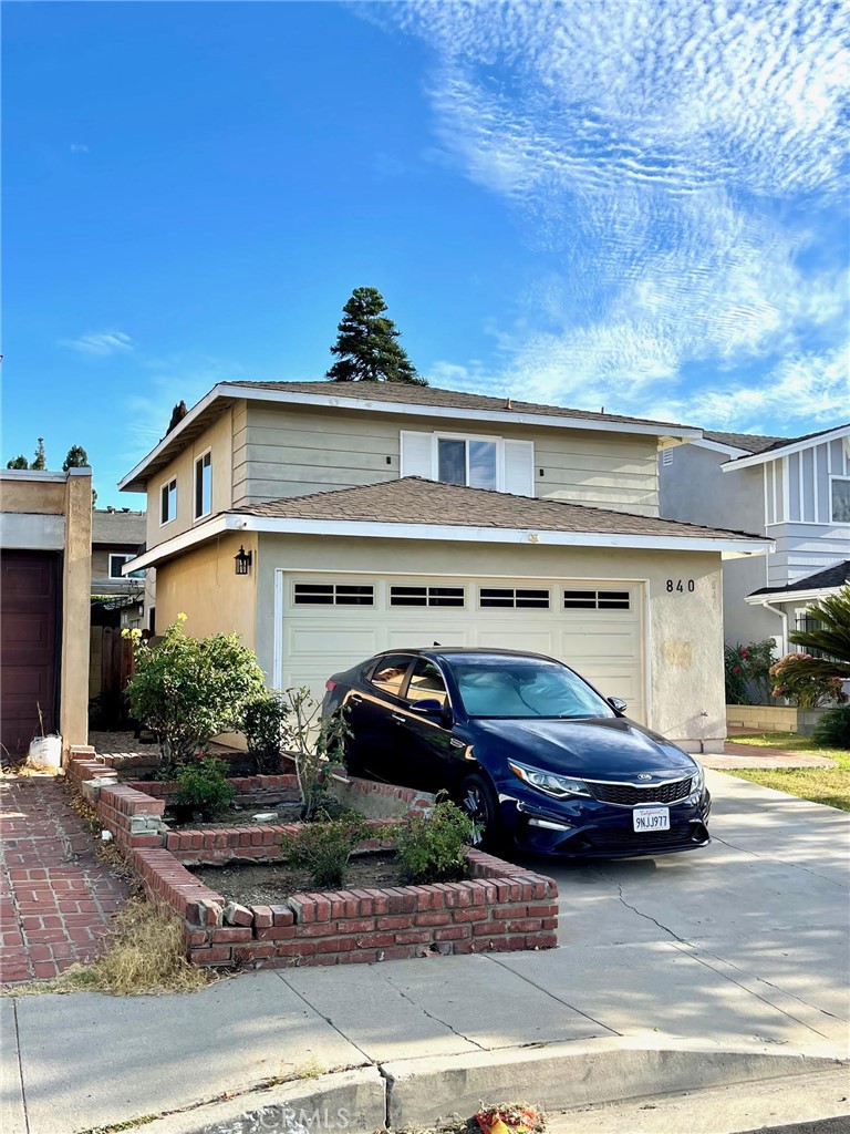 840 East Meadbrook Street Carson, CA 90746 - Photo 4 of 32 a car parked in front of a building
