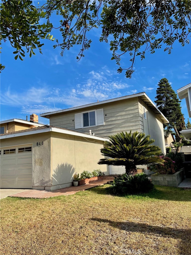840 East Meadbrook Street Carson, CA 90746 - Photo 5 of 32 a view of a house with a yard