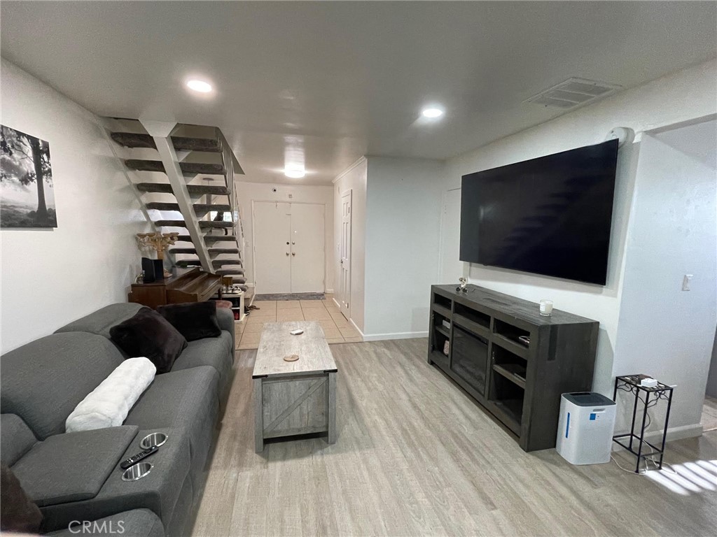 840 East Meadbrook Street Carson, CA 90746 - Photo 8 of 32 a living room with furniture and a flat screen tv