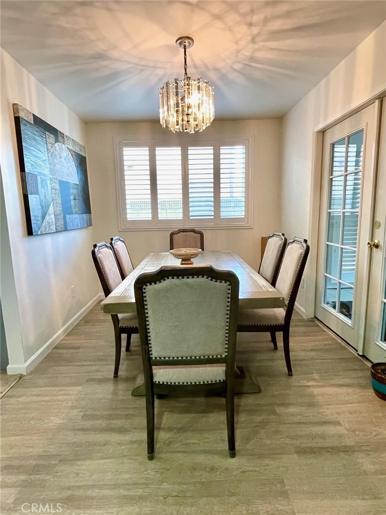 840 East Meadbrook Street Carson, CA 90746 - Photo 10 of 32 a living room with furniture and a chandelier