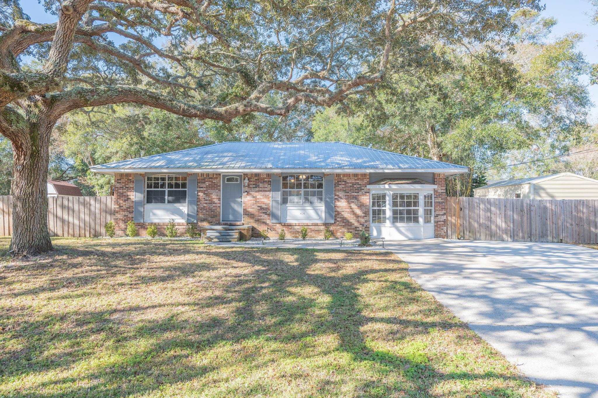 414 Jasmine Road St. Augustine, FL 32086 - Photo 1 of 30 a view of a house with a yard and sitting area