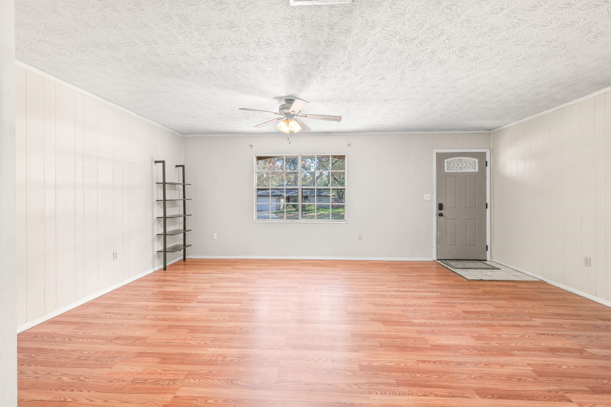 414 Jasmine Road St. Augustine, FL 32086 - Photo 6 of 30 a view of an empty room with a window and a ceiling fan