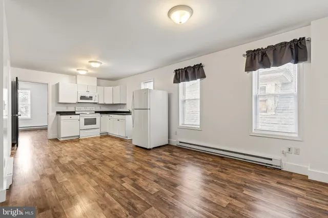 a view of kitchen with wooden floor