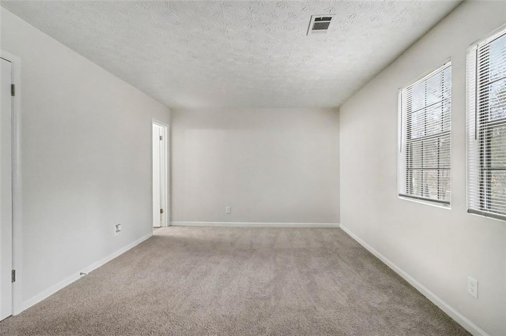 3723 Chimney Ridge Court Ellenwood, GA 30294 - Photo 16 of 33 an empty room with windows