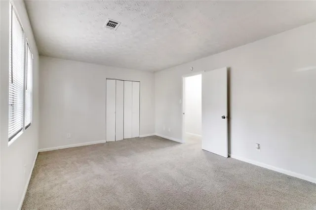 a picture of a bench in front of a wall