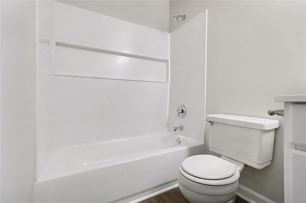 3723 Chimney Ridge Court Ellenwood, GA 30294 - Photo 20 of 33 a white toilet sitting next to a bath tub