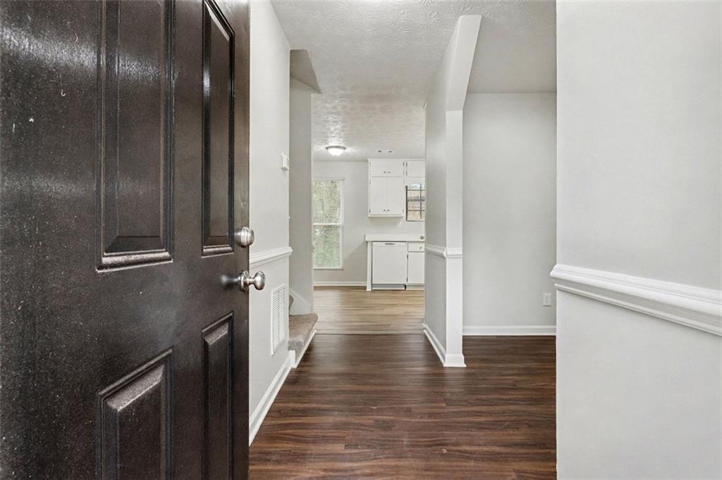3723 Chimney Ridge Court Ellenwood, GA 30294 - Photo 2 of 33 a view of a hallway with wooden floor
