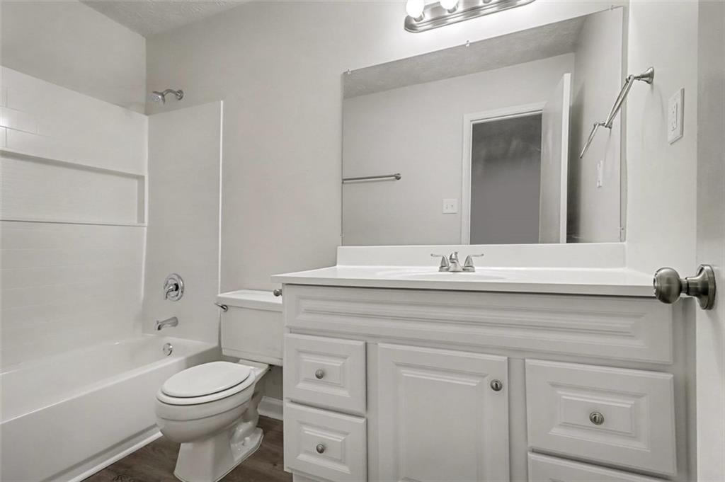 3723 Chimney Ridge Court Ellenwood, GA 30294 - Photo 22 of 33 a bathroom with a sink a toilet and shower