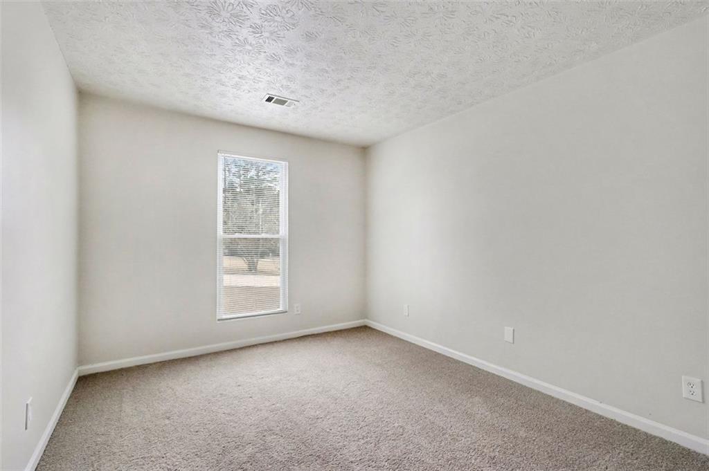 3723 Chimney Ridge Court Ellenwood, GA 30294 - Photo 23 of 33 an empty room with a window