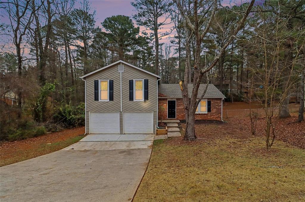 3723 Chimney Ridge Court Ellenwood, GA 30294 - Photo 28 of 33 a house with a tree in front of it