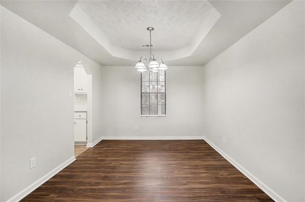 3723 Chimney Ridge Court Ellenwood, GA 30294 - Photo 6 of 33 a view of a room with window and wooden floor