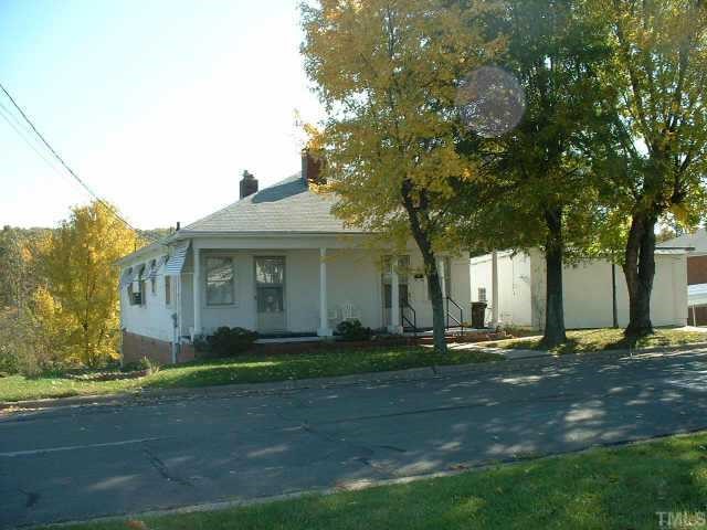 210 Allgood Street Roxboro, NC 27573 - Photo 1 of 1 a front view of a house with a yard