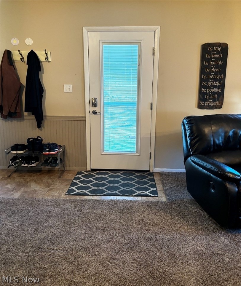 2514 Raber Road, Unit 4A Uniontown, OH 44685 - Photo 2 of 13 Doorway to outside with carpet floors and plenty of natural light