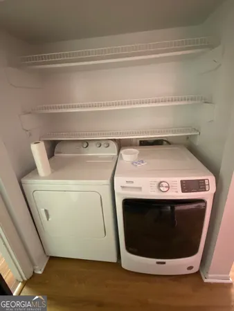 a utility room with dryer and washer