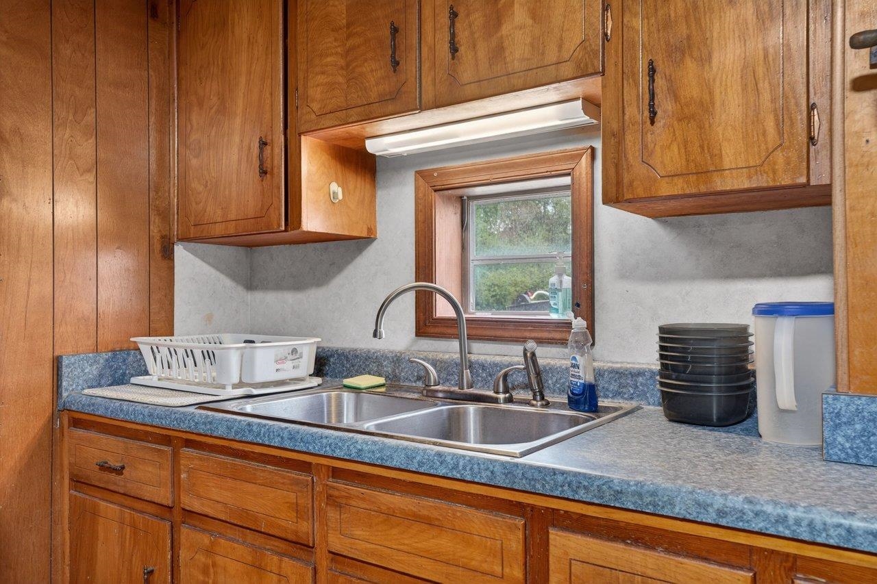 724 Newtown Road Elkton, VA 22827 - Photo 8 of 38 a kitchen with granite countertop stainless steel appliances a sink and cabinets