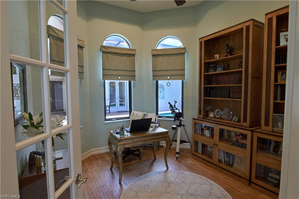 7389 Byrons Way Naples, FL 34113 - Photo 11 of 35 a view of a livingroom with furniture and window
