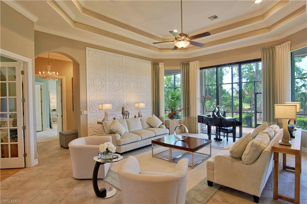 7389 Byrons Way Naples, FL 34113 - Photo 13 of 35 a living room with furniture and a large window
