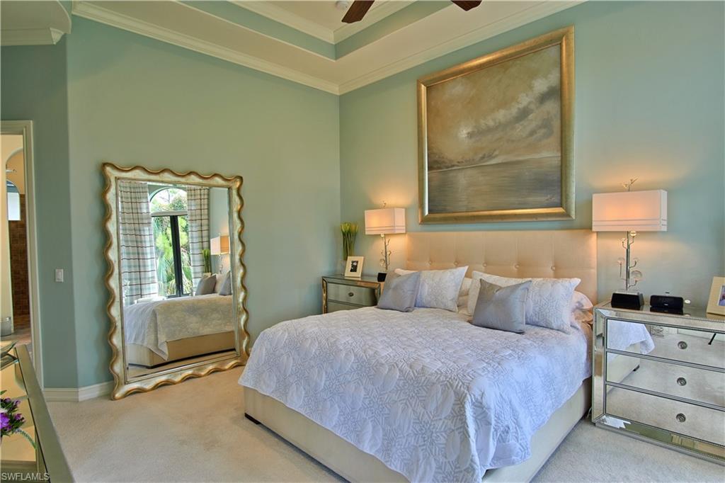 7389 Byrons Way Naples, FL 34113 - Photo 17 of 35 a bedroom with a bed and a window