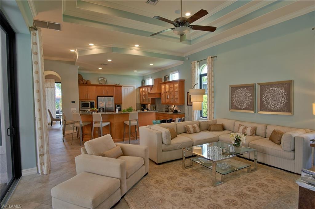 7389 Byrons Way Naples, FL 34113 - Photo 26 of 35 a living room with furniture and a large window