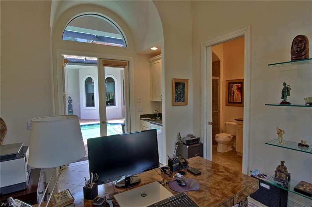 7389 Byrons Way Naples, FL 34113 - Photo 27 of 35 a living room with furniture and a flat screen tv