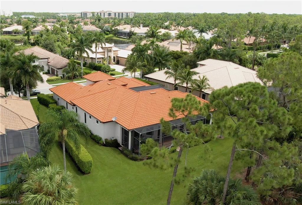 7389 Byrons Way Naples, FL 34113 - Photo 5 of 35 an aerial view of a house with yard swimming pool and outdoor seating