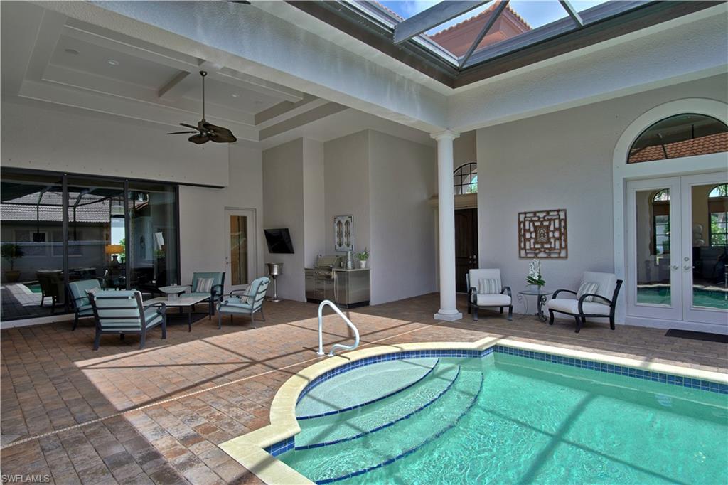 7389 Byrons Way Naples, FL 34113 - Photo 10 of 35 a room with lots of table and chairs