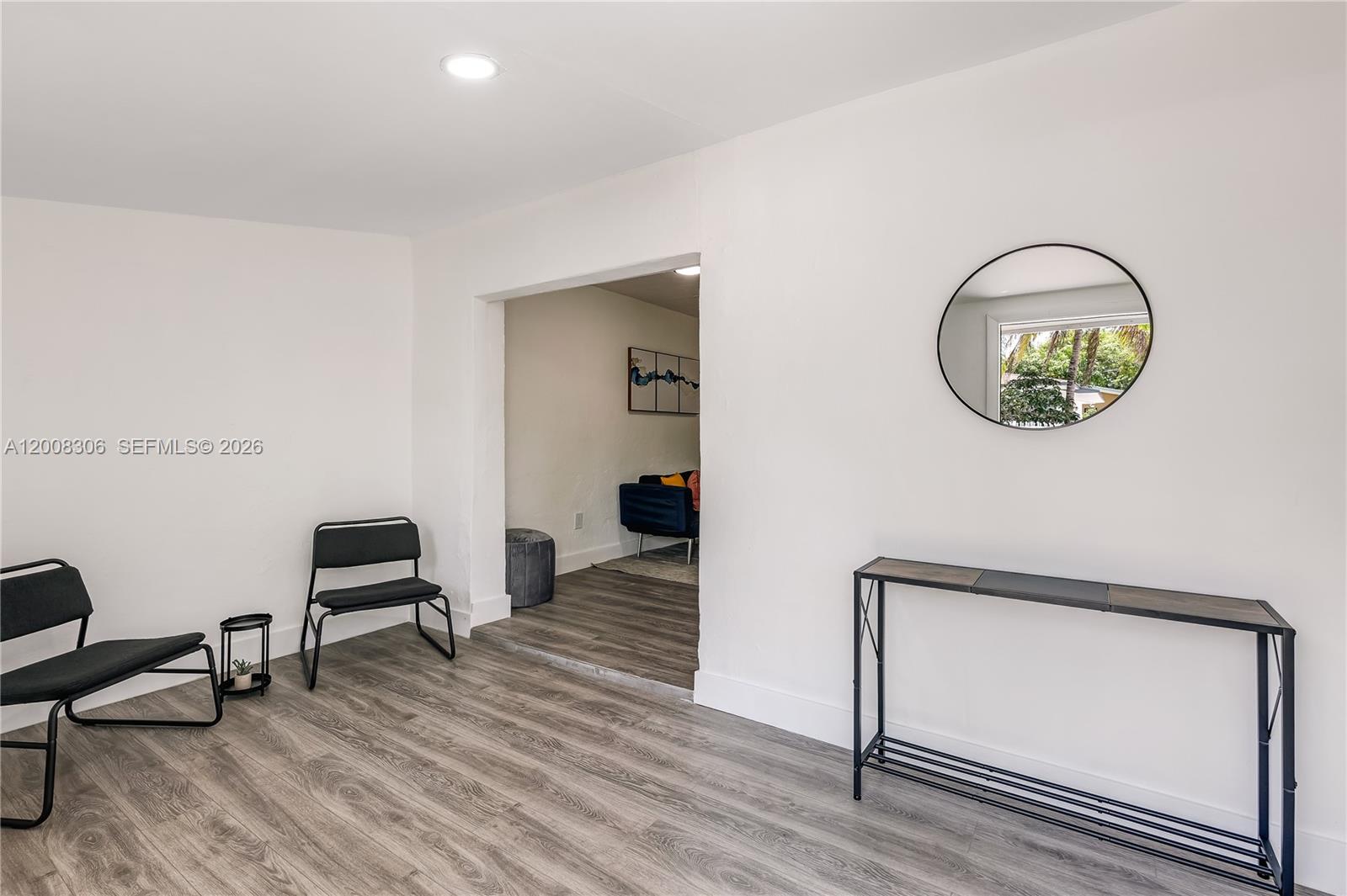 327 Northeast 55th Street, Unit 2 Miami, FL 33137 - Photo 3 of 14 a view of room with wooden floor