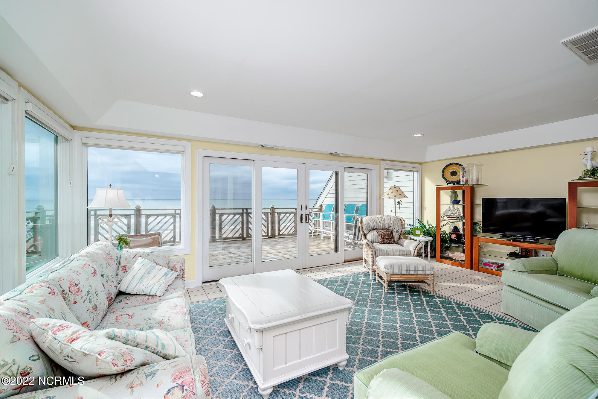 301 Salter Path Road, Unit 14 GENESIS Pine Knoll Shores, NC 28512 - Photo 13 of 62 Light-filled living room w/ corner views