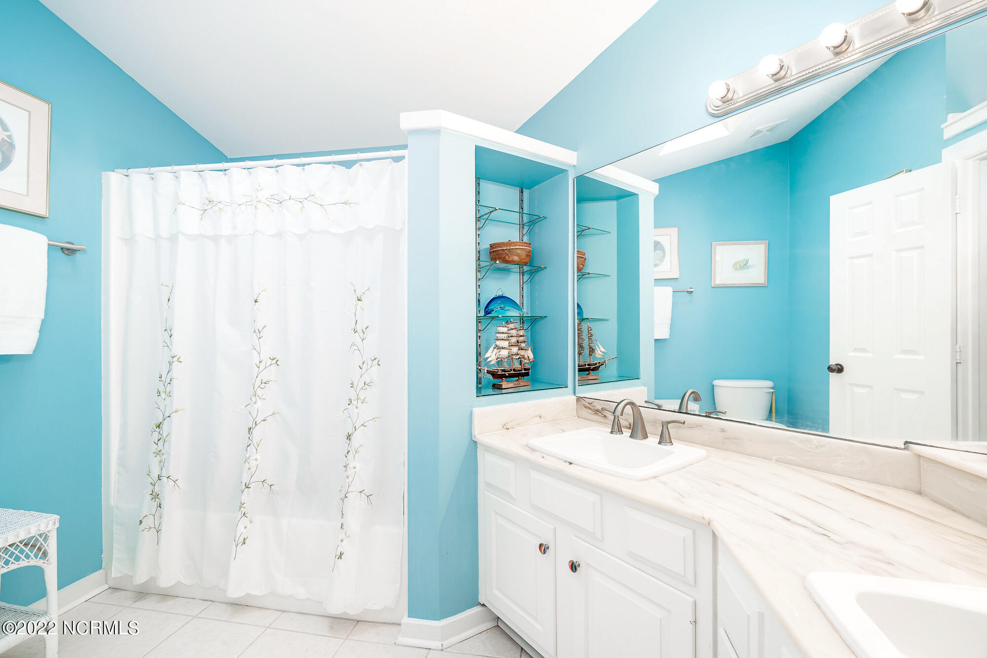 301 Salter Path Road, Unit 14 GENESIS Pine Knoll Shores, NC 28512 - Photo 34 of 62 En suite guest bathroom