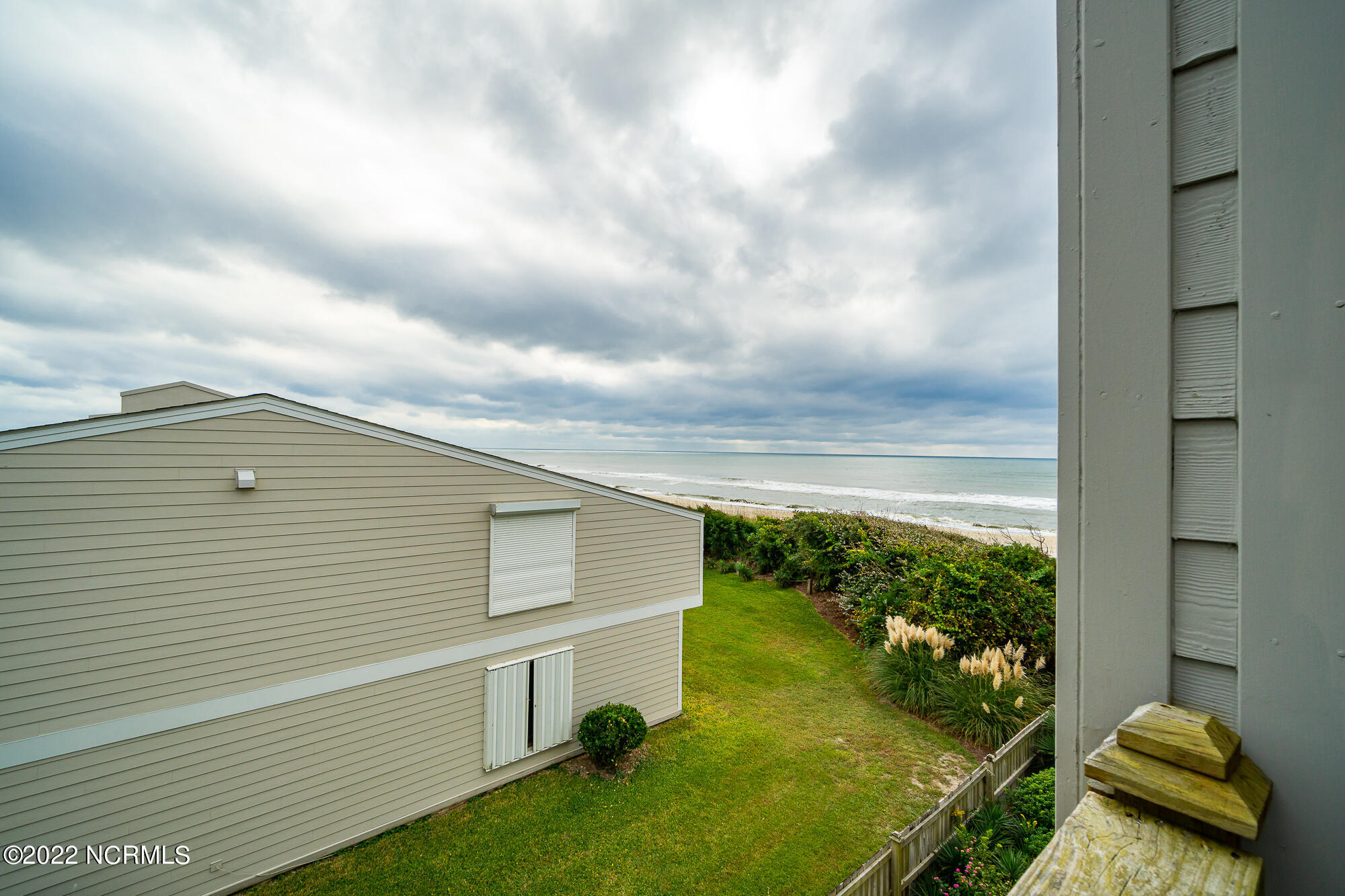 301 Salter Path Road, Unit 14 GENESIS Pine Knoll Shores, NC 28512 - Photo 35 of 62 Small deck off guest suite