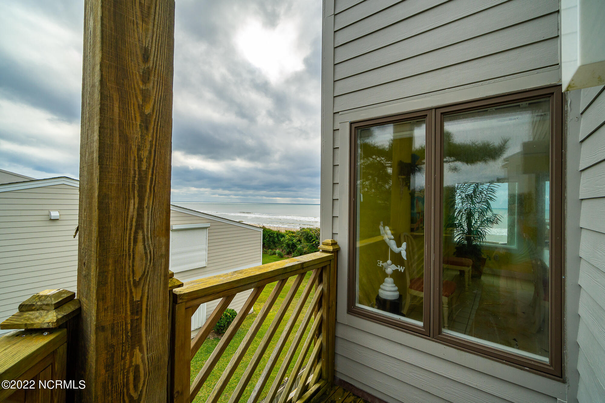 301 Salter Path Road, Unit 14 GENESIS Pine Knoll Shores, NC 28512 - Photo 37 of 62 Small deck off guest suite