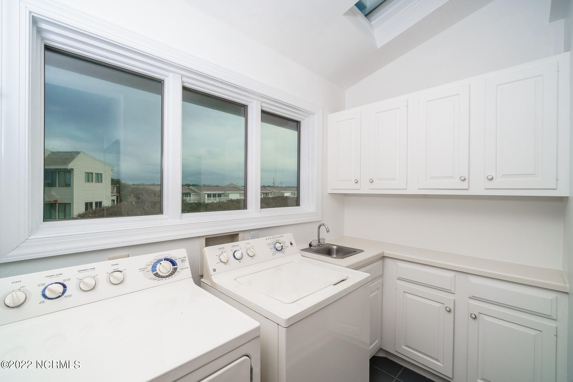 301 Salter Path Road, Unit 14 GENESIS Pine Knoll Shores, NC 28512 - Photo 42 of 62 Laundry roon