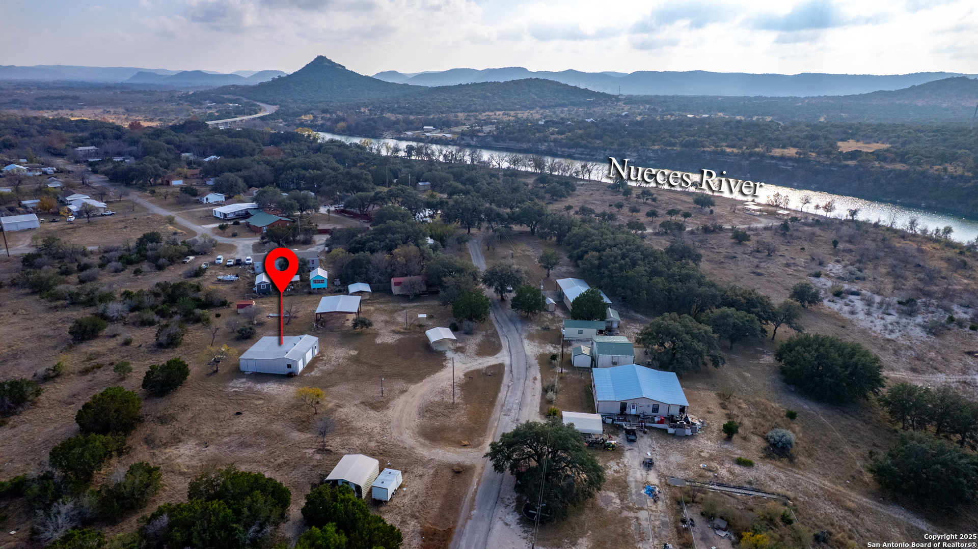 33 North River View Road Camp Wood, TX 78833 - Photo 13 of 27 an aerial view of a city and mountain view
