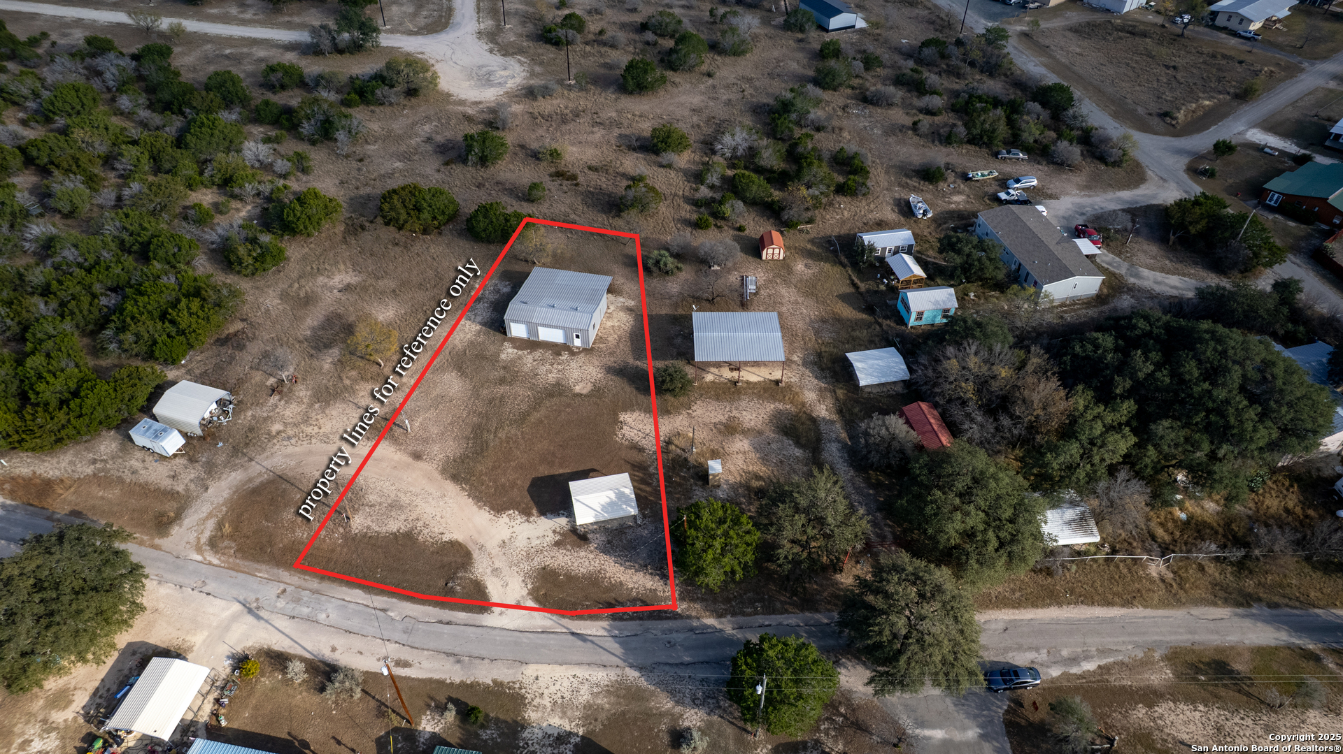 33 North River View Road Camp Wood, TX 78833 - Photo 16 of 27 an aerial view of a house with a yard