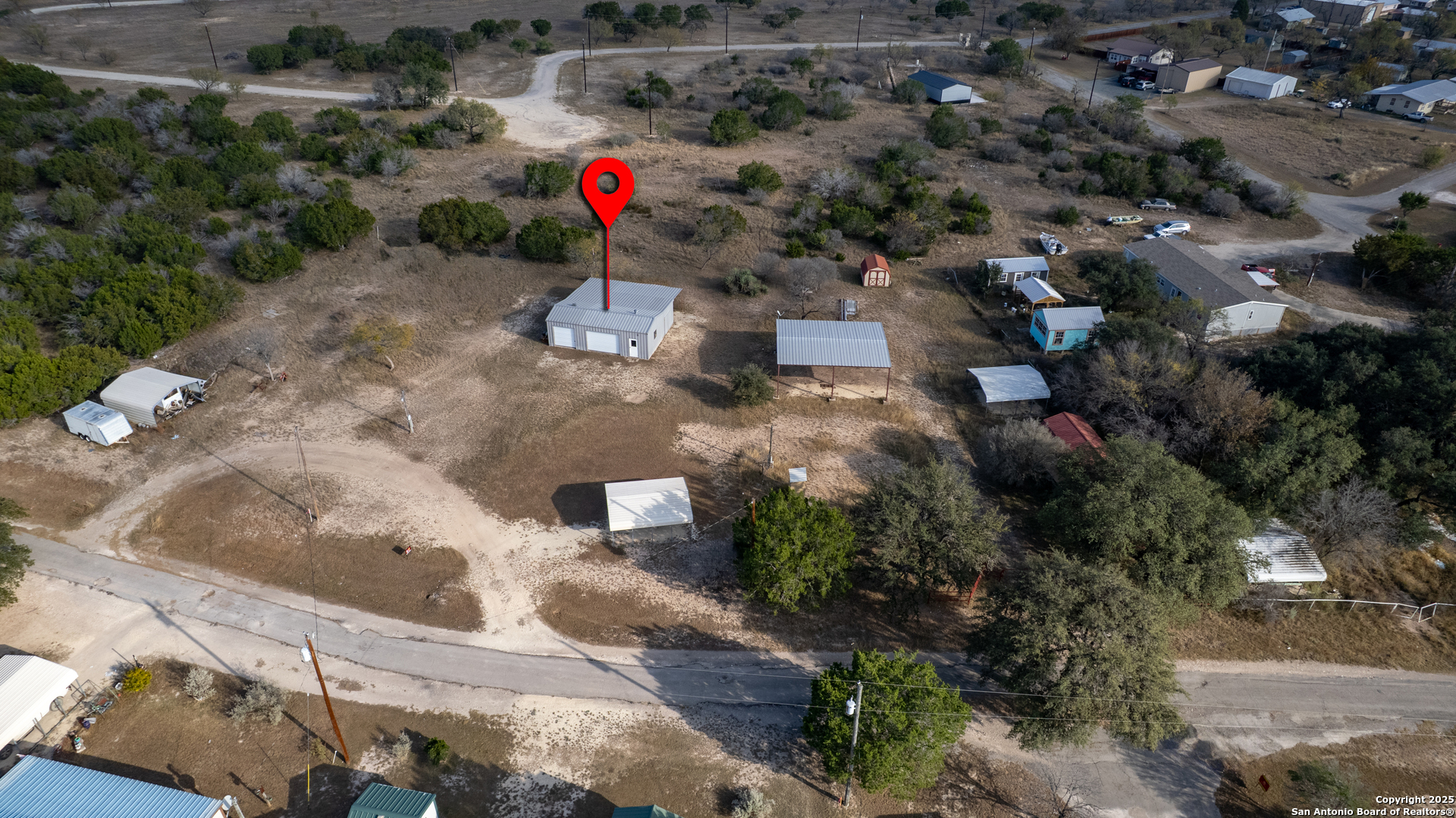 33 North River View Road Camp Wood, TX 78833 - Photo 17 of 27 an aerial view of a house with a yard and lake view