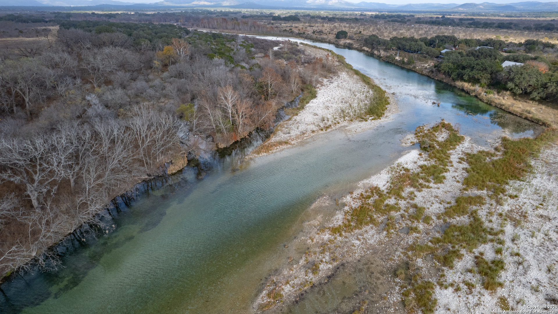 33 North River View Road Camp Wood, TX 78833 - Photo 18 of 27 a view of a lake with beach and mountain view