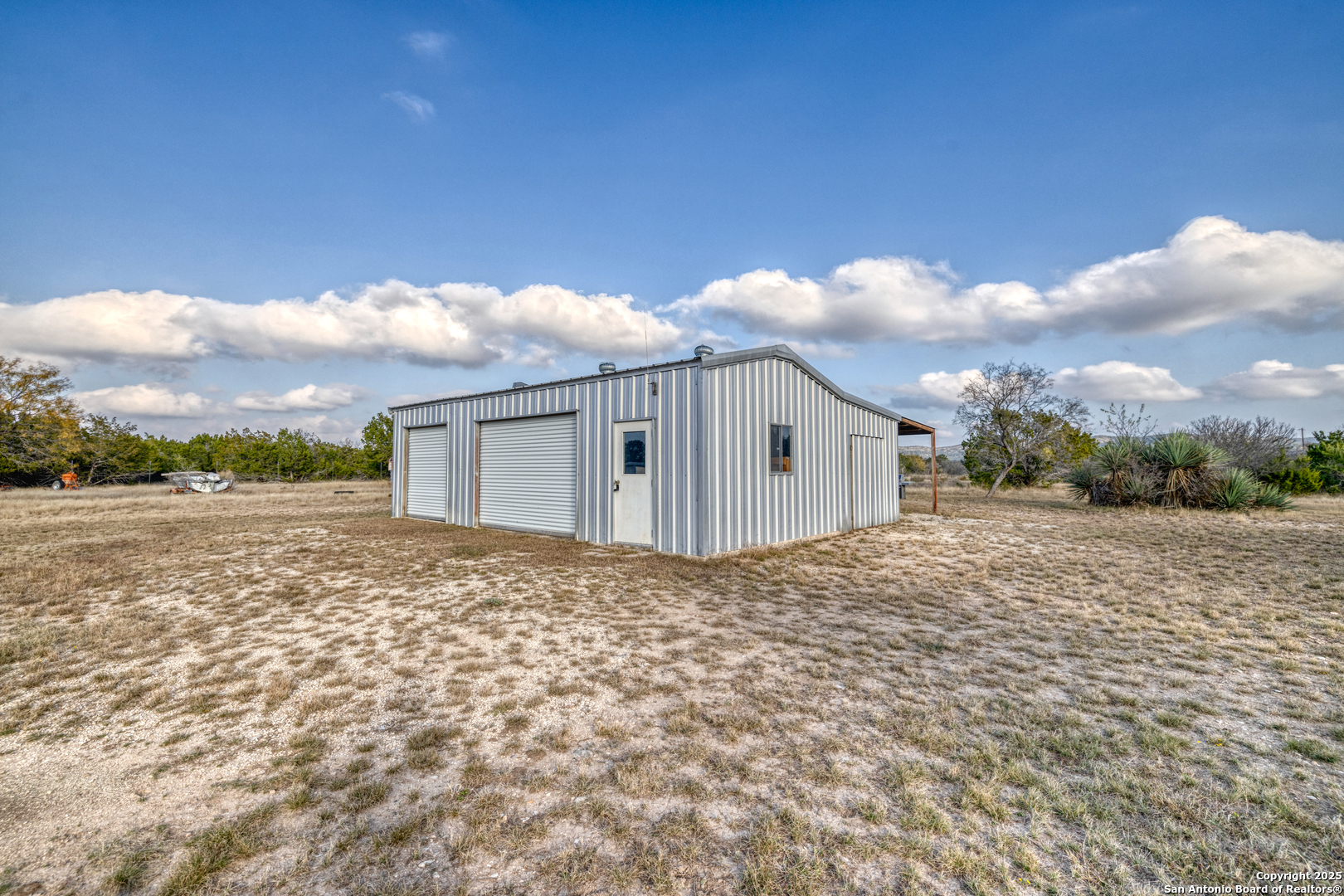 33 North River View Road Camp Wood, TX 78833 - Photo 2 of 27 a view of backyard of house