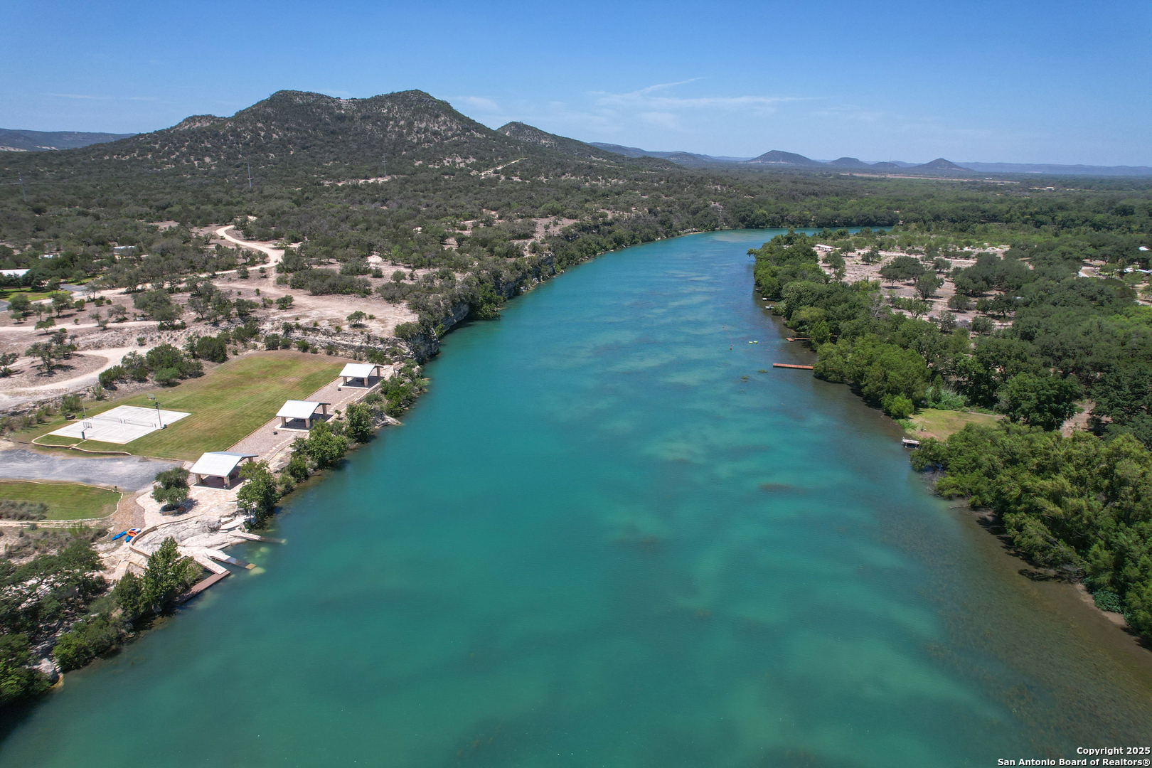 33 North River View Road Camp Wood, TX 78833 - Photo 22 of 27 a view of a town with mountains in the background