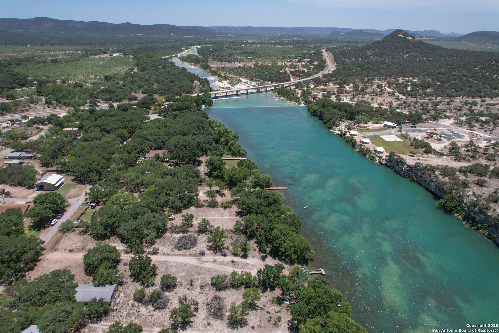 33 North River View Road Camp Wood, TX 78833 - Photo 27 of 27 an aerial view of residential houses with outdoor space and trees
