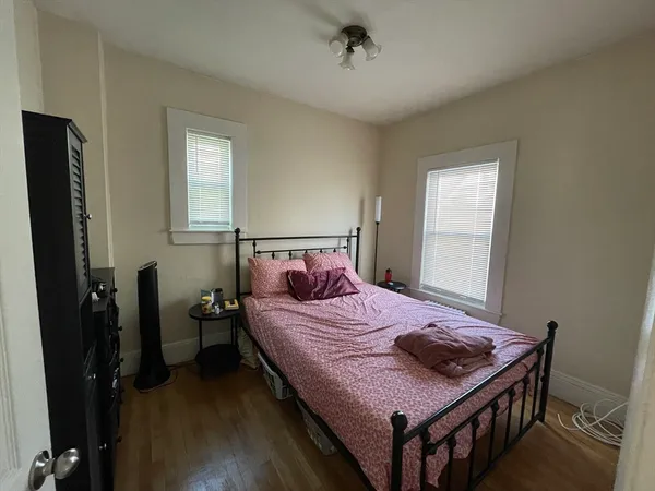 a bedroom with a bed and a table in it