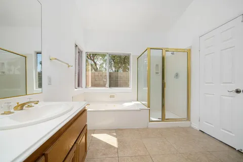 a bathroom with a bathtub and a shower