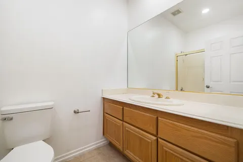 a bathroom with a sink a vanity and a mirror