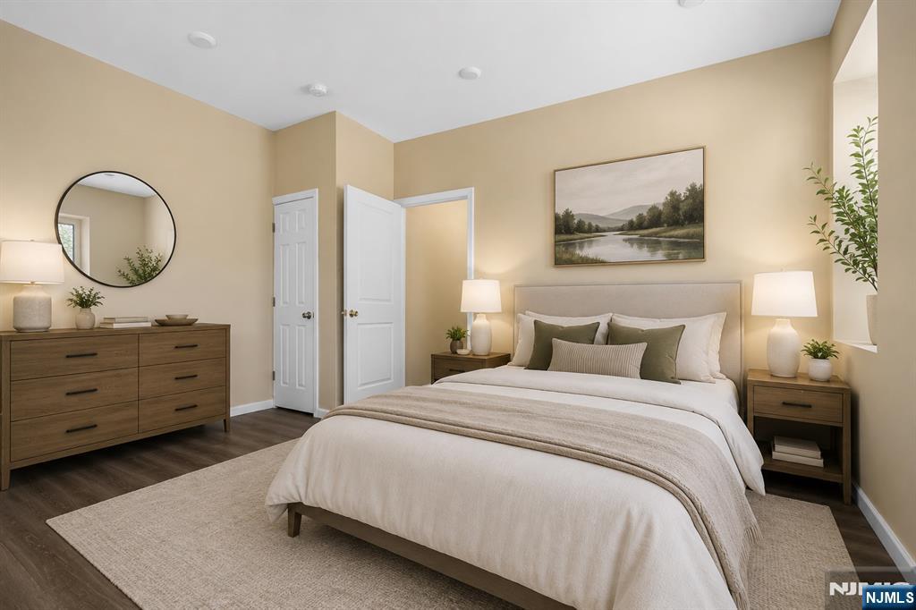 183 Bergen Turnpike Ridgefield Park, NJ 07660 - Photo 7 of 18 a bedroom with a bed and a dresser