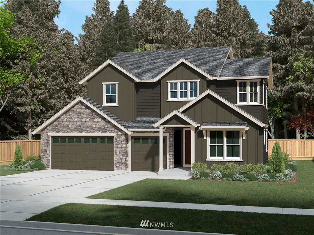 4907 Southeast 3rd Place Renton, WA 98059 - Photo 1 of 1 a front view of a house with a garden
