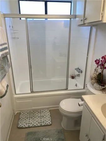 a bathroom with a toilet a sink and a shower